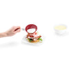 Cuisipro egg silicone poacher set of 2 in red - product image of a poached egg being placed on a sandwich Danielle Walker